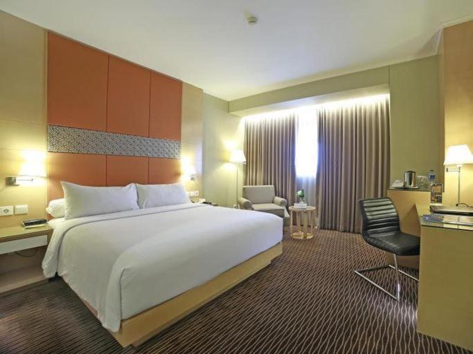 Letto o letti in una camera di All Sedayu Hotel Kelapa Gading
