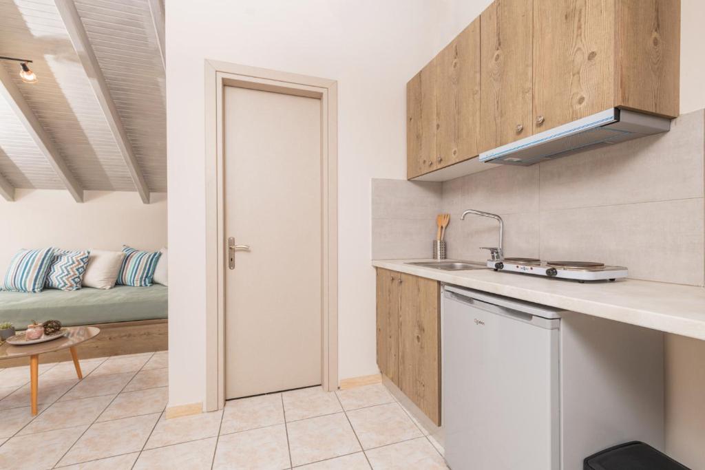 Kuchyň nebo kuchyňský kout v ubytování Koukos Loft Apartments
