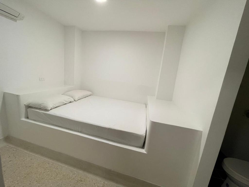 Postel nebo postele na pokoji v ubytování El Faro Hostel