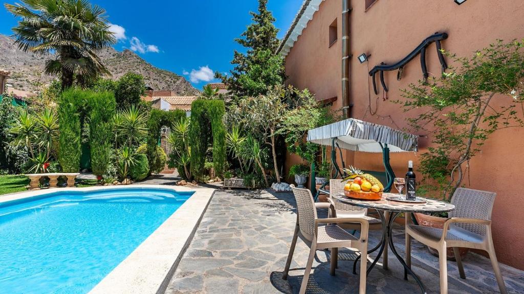 The swimming pool at or close to Casa Rural La Rubia Nigüelas by Ruralidays