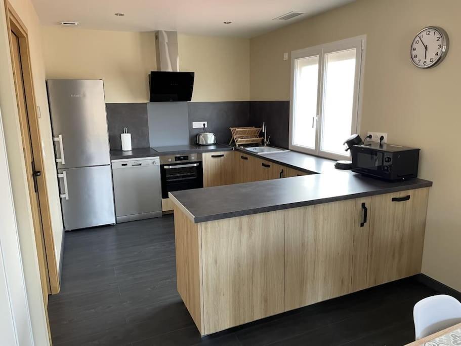 Kuchyňa alebo kuchynka v ubytovaní Magnifique appartement T3 tout confort