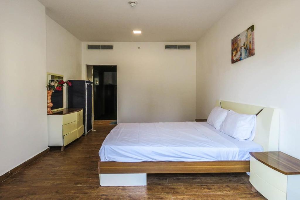 Postel nebo postele na pokoji v ubytování Super OYO 762 Home G01 ALCOVE 1BR