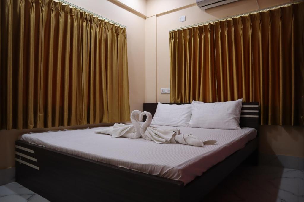 Postel nebo postele na pokoji v ubytování Hotel Saan Berhampore