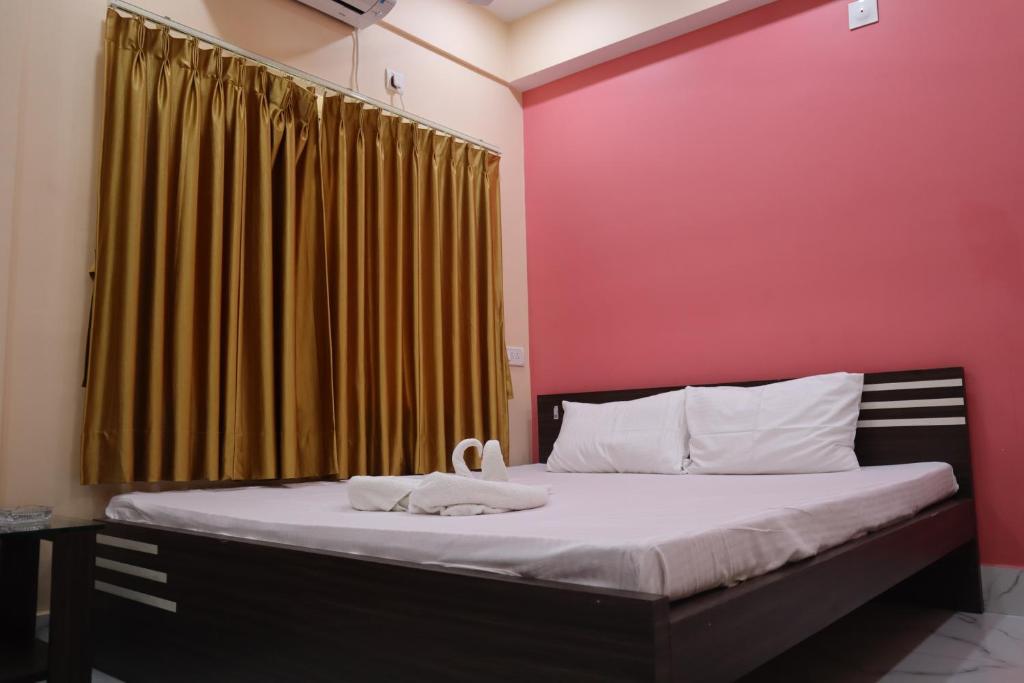 Postel nebo postele na pokoji v ubytování Hotel Saan Berhampore