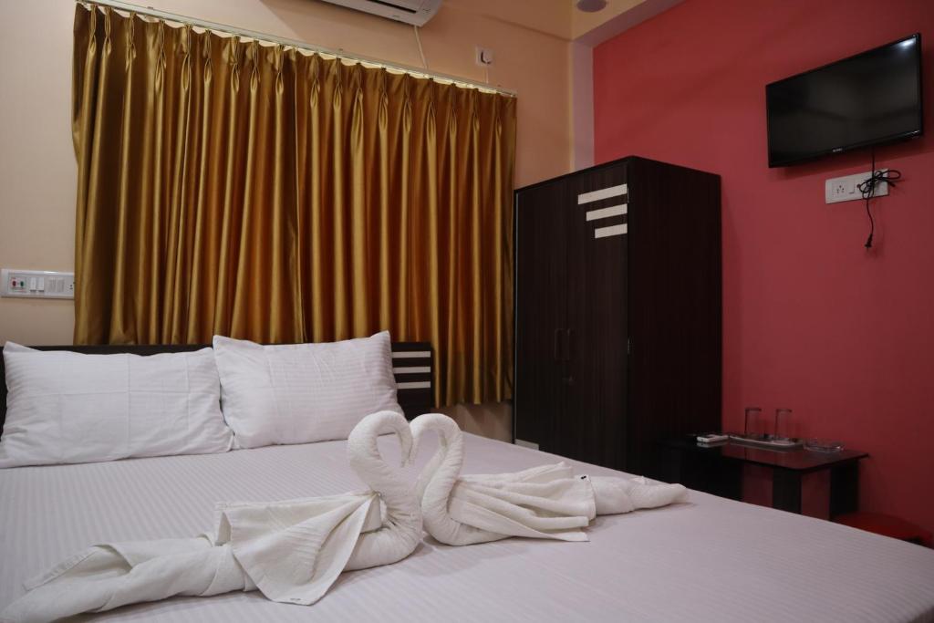 Postel nebo postele na pokoji v ubytování Hotel Saan Berhampore