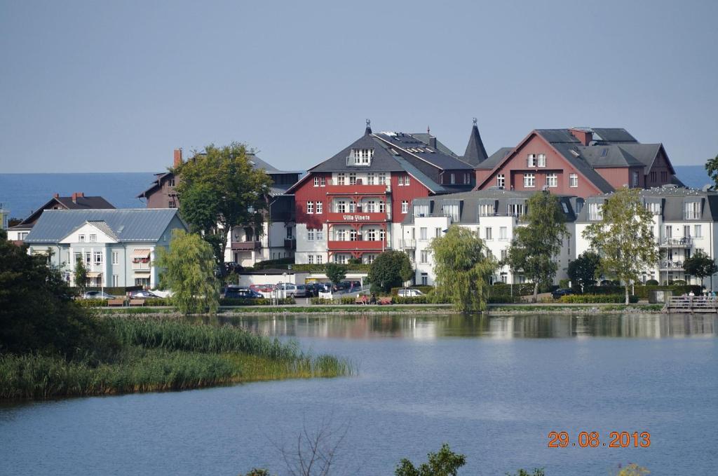 a group of houses next to a body of water at Vineta-App-02 in Heringsdorf