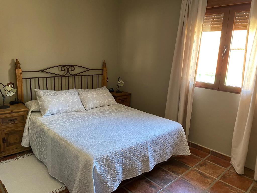 Postel nebo postele na pokoji v ubytování Casa Rural El Corral