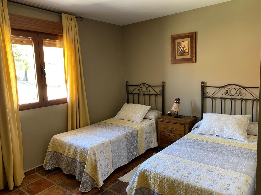 Postel nebo postele na pokoji v ubytování Casa Rural El Corral