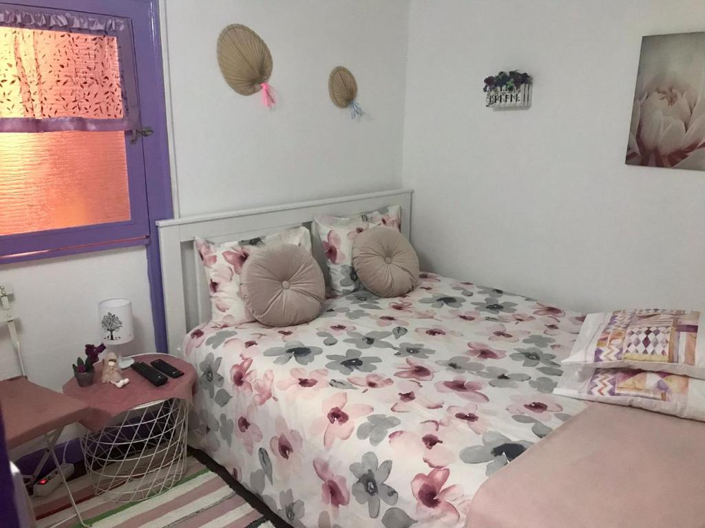 Casa das Bonecas tesisinde bir odada yatak veya yataklar