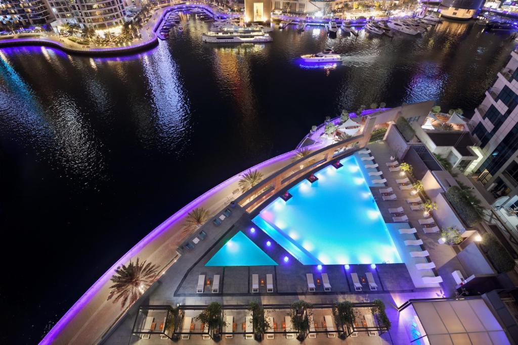 an overhead view of a bridge over the water at night at InterContinental Dubai Marina by IHG in Dubai