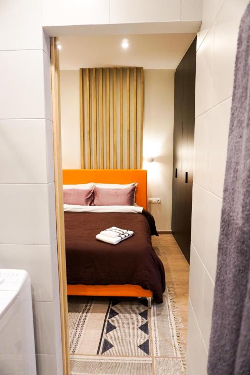 Postel nebo postele na pokoji v ubytování Boho Privet Flat in Athens