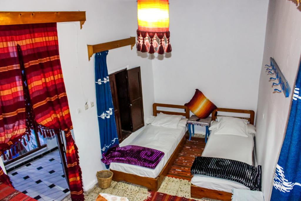 Postel nebo postele na pokoji v ubytování Cordoba Pension