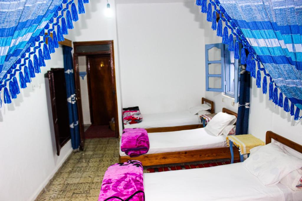 Postel nebo postele na pokoji v ubytování Cordoba Pension