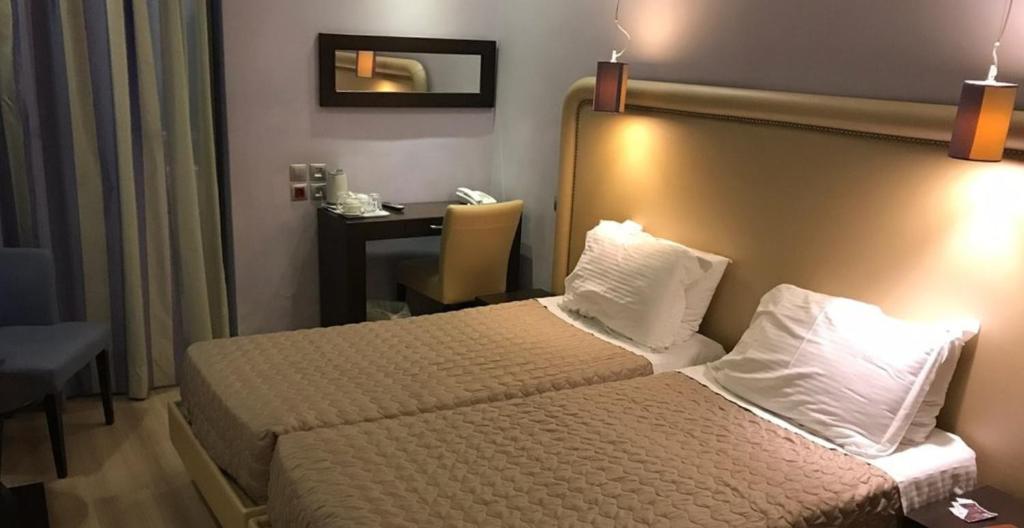 A bed or beds in a room at Olympic Palladium