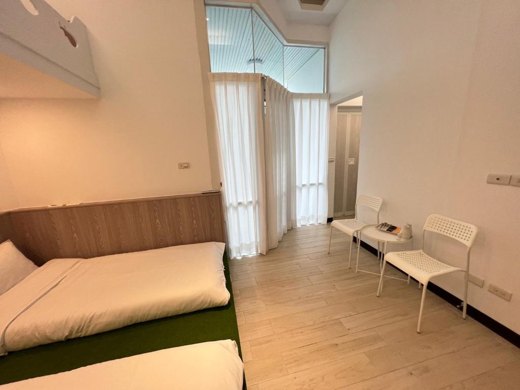 Postel nebo postele na pokoji v ubytování 高一 33 班 Homestay 1982
