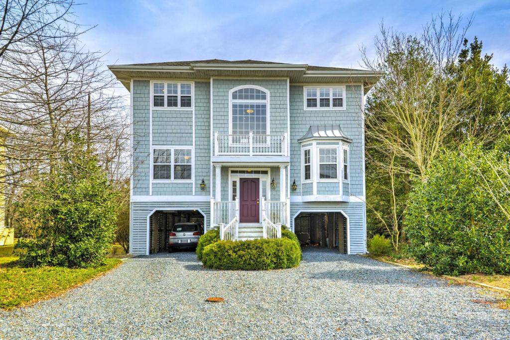a blue house with a driveway in front of it at Bethany Beach House 750 Feet from Ocean! in Bethany Beach