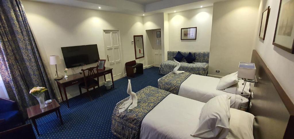 TV a/nebo společenská místnost v ubytování Horus House Hotel Zamalek