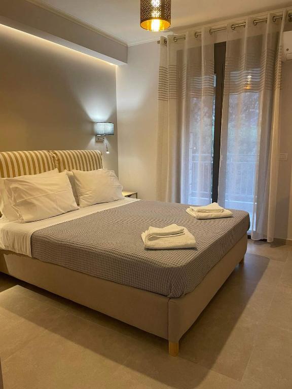 Łóżko lub łóżka w pokoju w obiekcie Iris Villas Complex