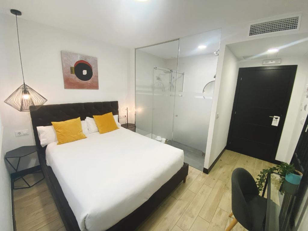 A bed or beds in a room at La SIGRINA Tuy
