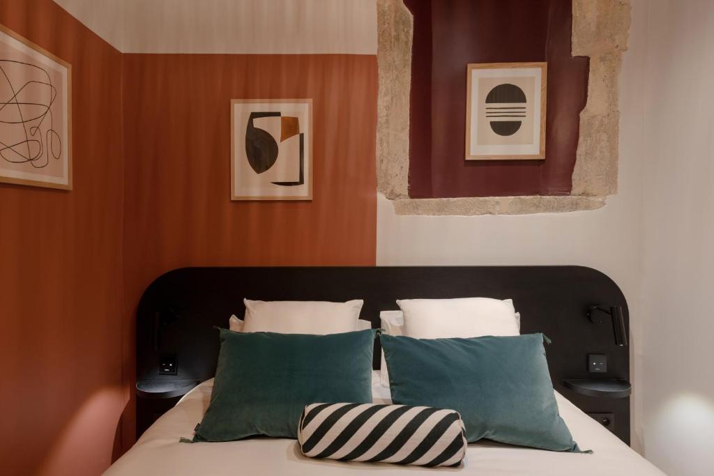 Postel nebo postele na pokoji v ubytování MiHotel Saint Jean