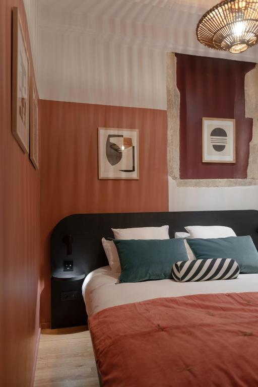 Postel nebo postele na pokoji v ubytování MiHotel Saint Jean