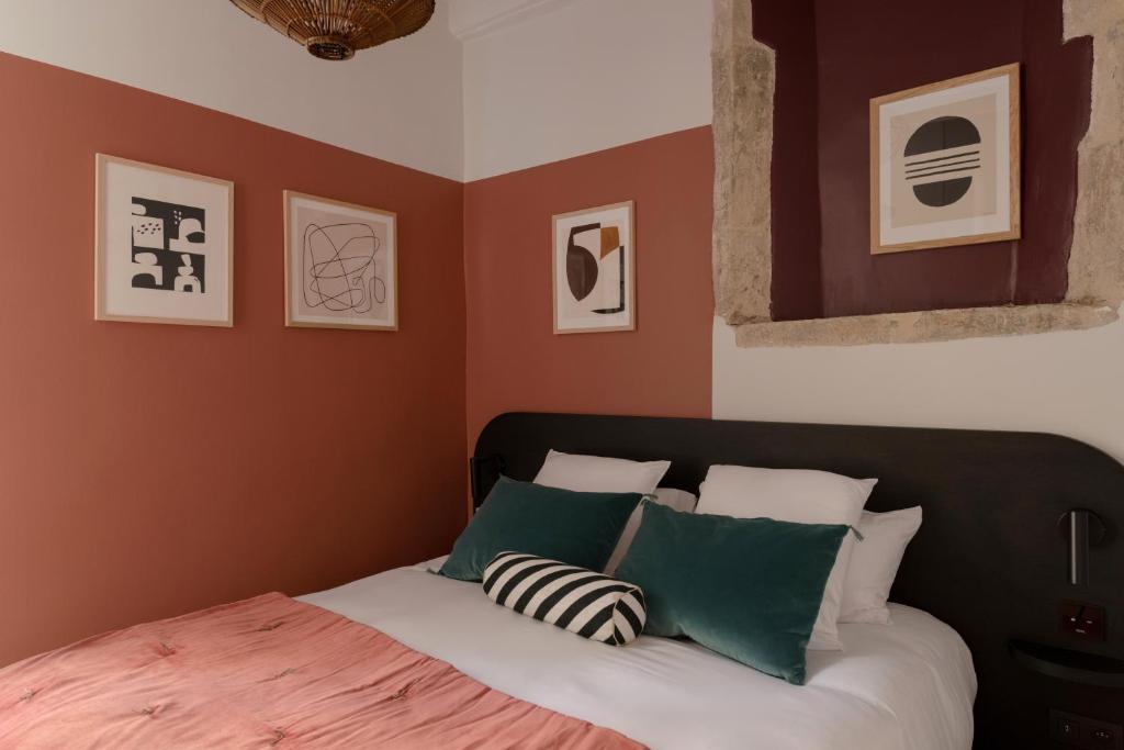 Postel nebo postele na pokoji v ubytování MiHotel Saint Jean