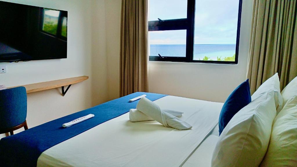 Postel nebo postele na pokoji v ubytování Ranthari Hotel and Spa Ukulhas Maldives