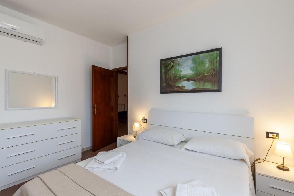 מיטה או מיטות בחדר ב-Residence Caravel 25