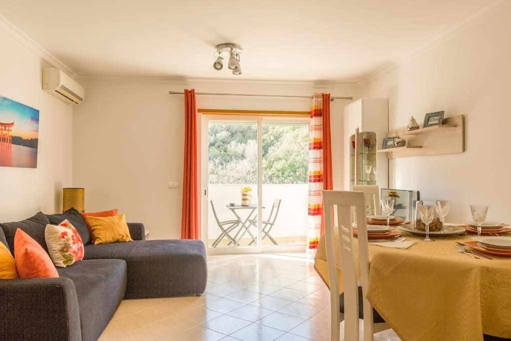 a living room with a couch and a table at Albufeira Old Town Two bedroom Apartment Center in Albufeira