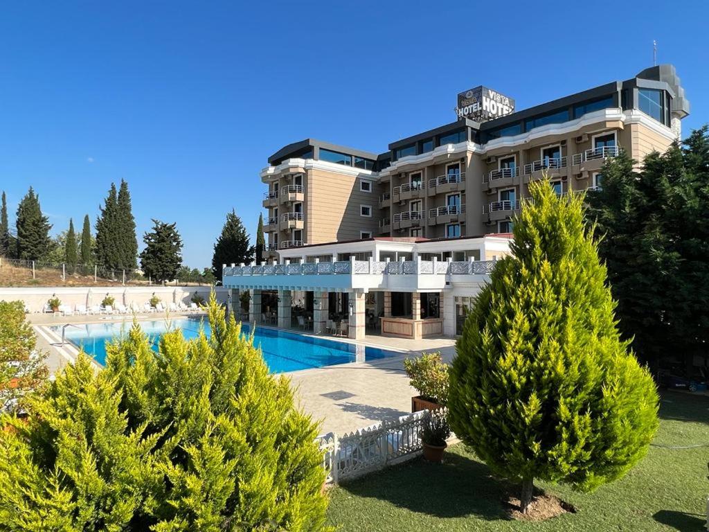 a hotel with a swimming pool in front of a building at Premier Vista Hotel in Silivri