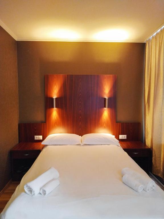 Postel nebo postele na pokoji v ubytování Milky Way Hotel