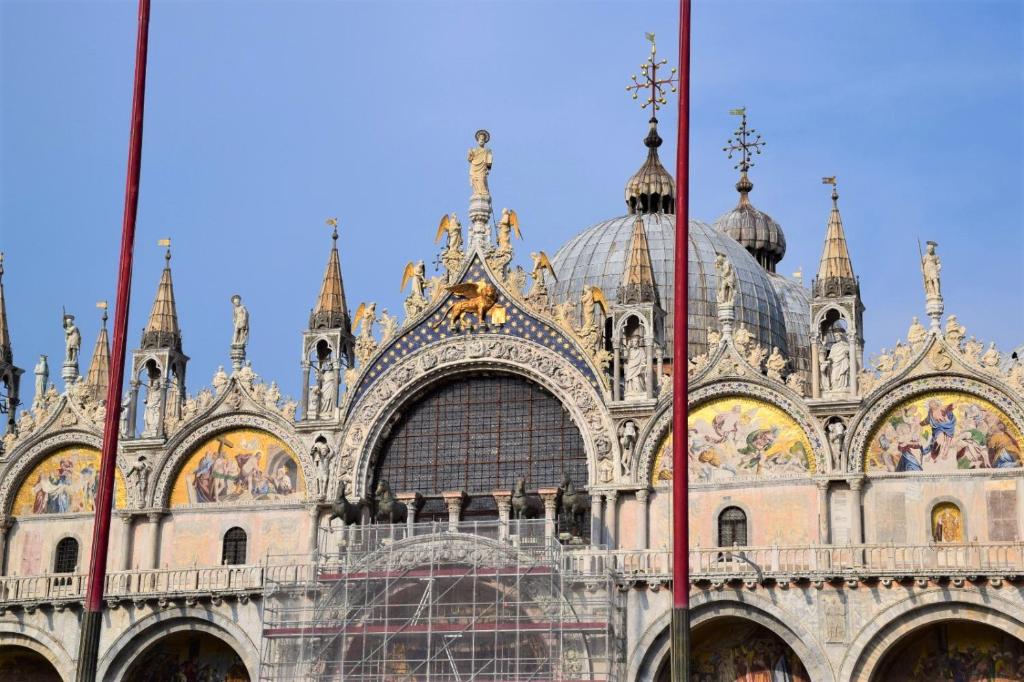 a large building with scaffolding in front of it at Le Pizzocchere in Venice