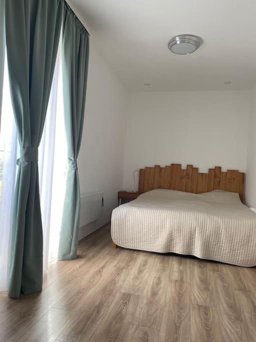 A bed or beds in a room at Buda Castle Toldy Apartment