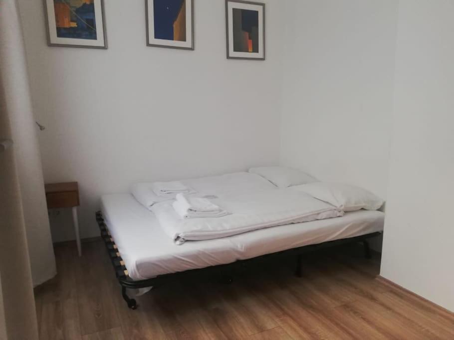 A bed or beds in a room at Buda Castle Toldy Apartment