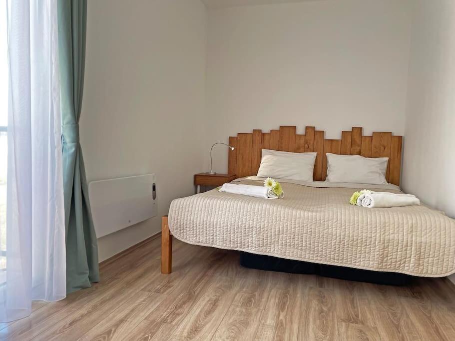 A bed or beds in a room at Buda Castle Toldy Apartment