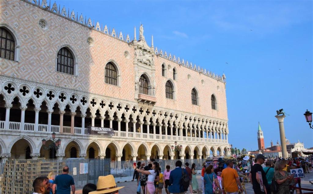 a group of people standing in front of a building at Le Pizzocchere in Venice