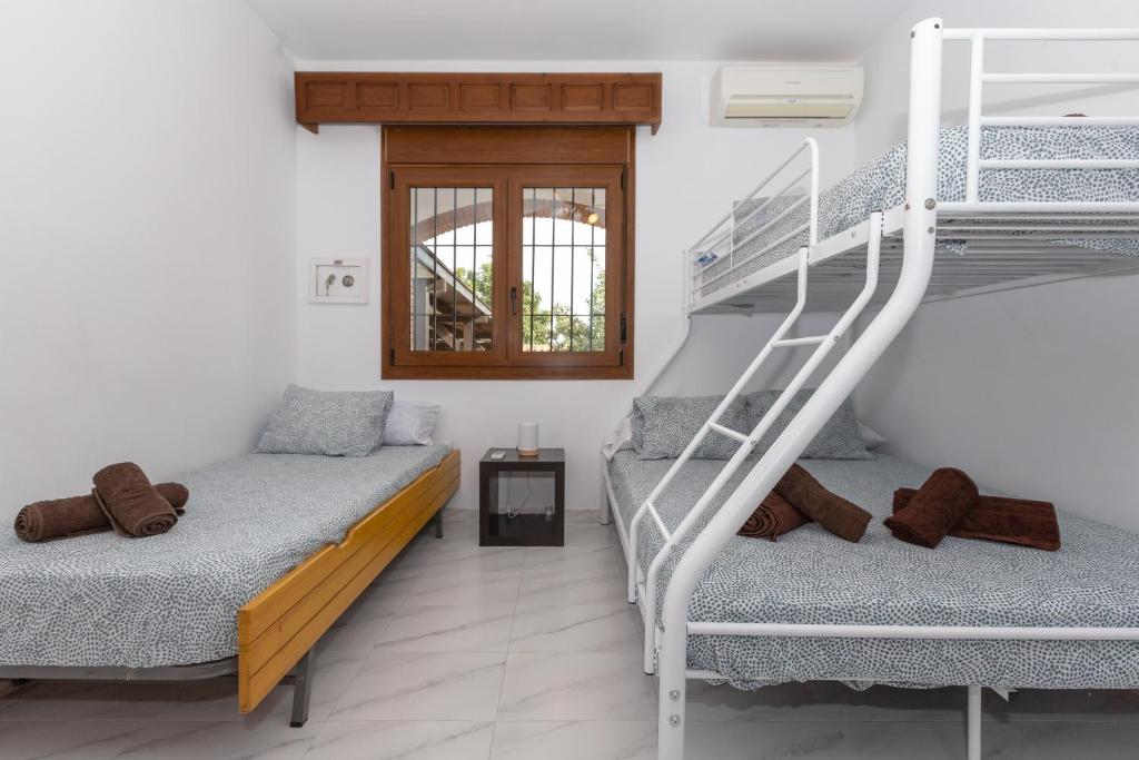 Posteľ alebo postele v izbe v ubytovaní Casa Guadalmar