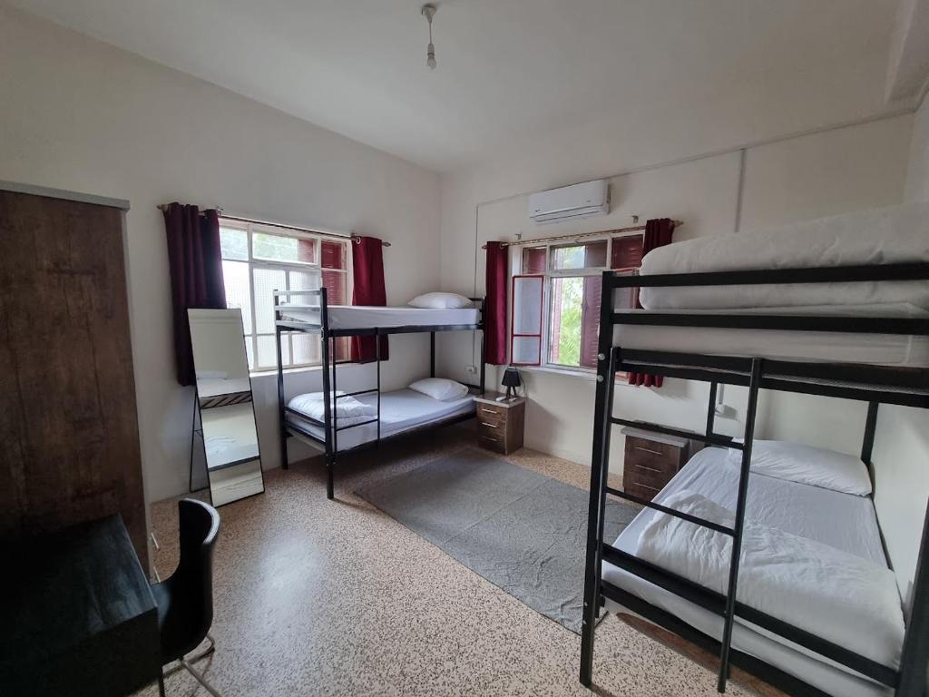 Postel nebo postele na pokoji v ubytování Rainbow Guest House