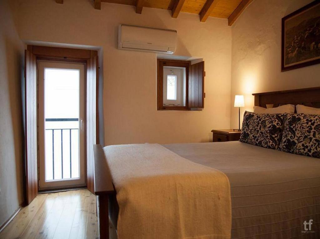 Postel nebo postele na pokoji v ubytování Estalagem de Marvão