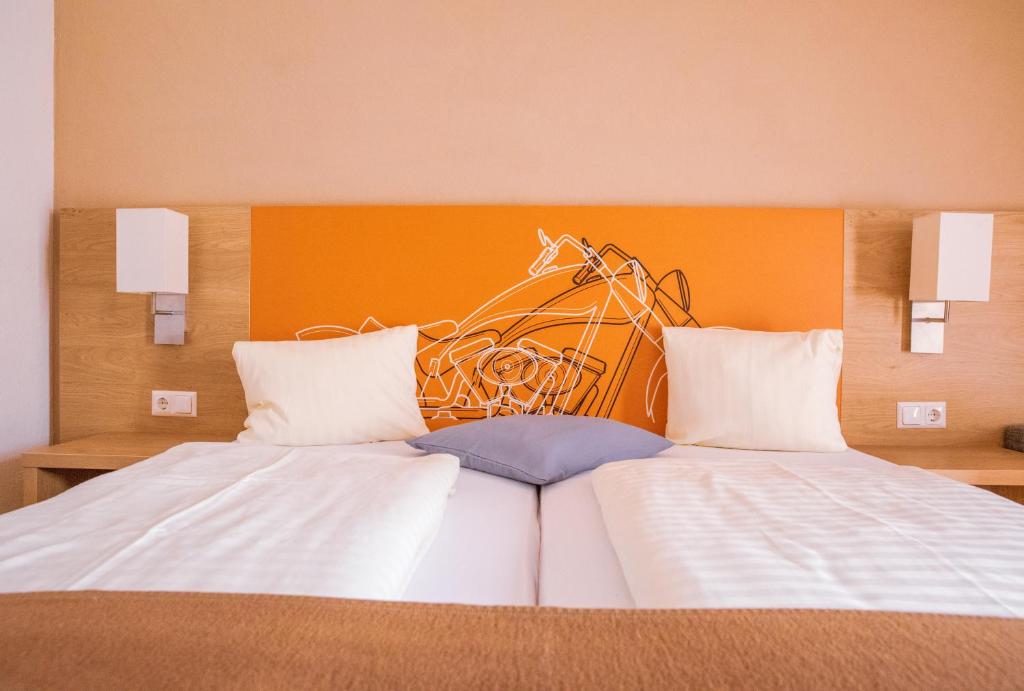 Postel nebo postele na pokoji v ubytování Hotel Kuchlerwirt