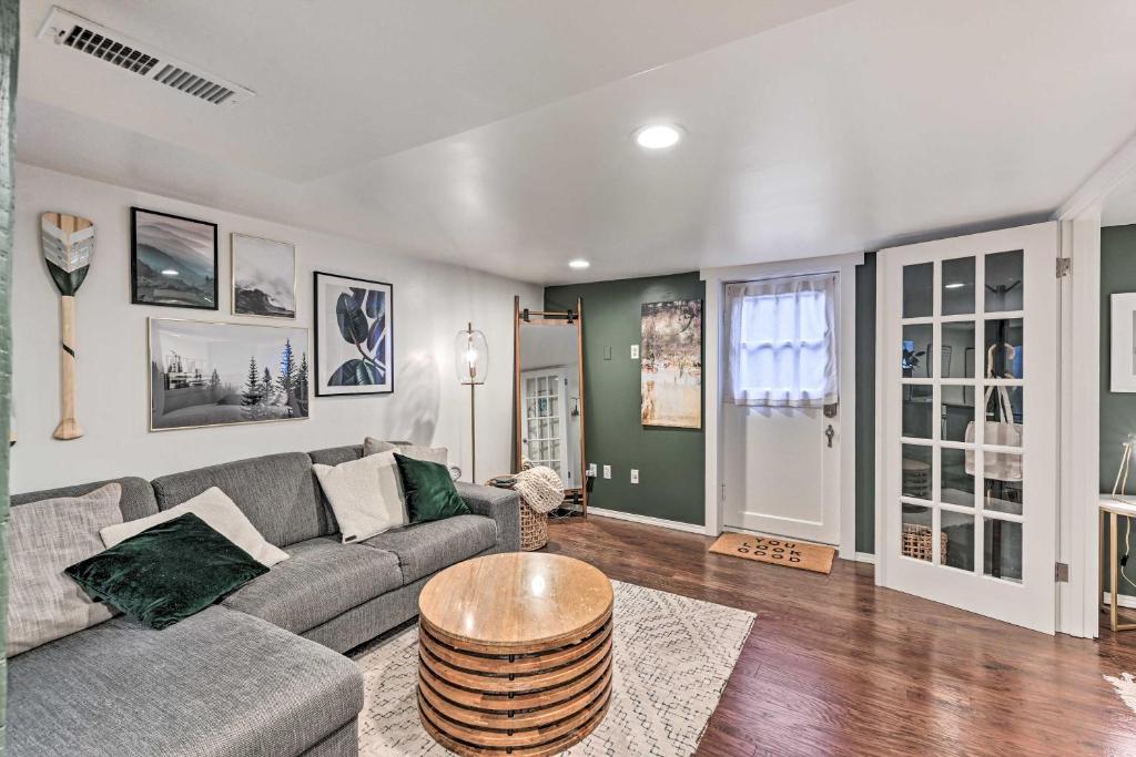 a living room with a couch and a table at Queen Anne Cottage Near Restaurants and Stadiums! in Seattle