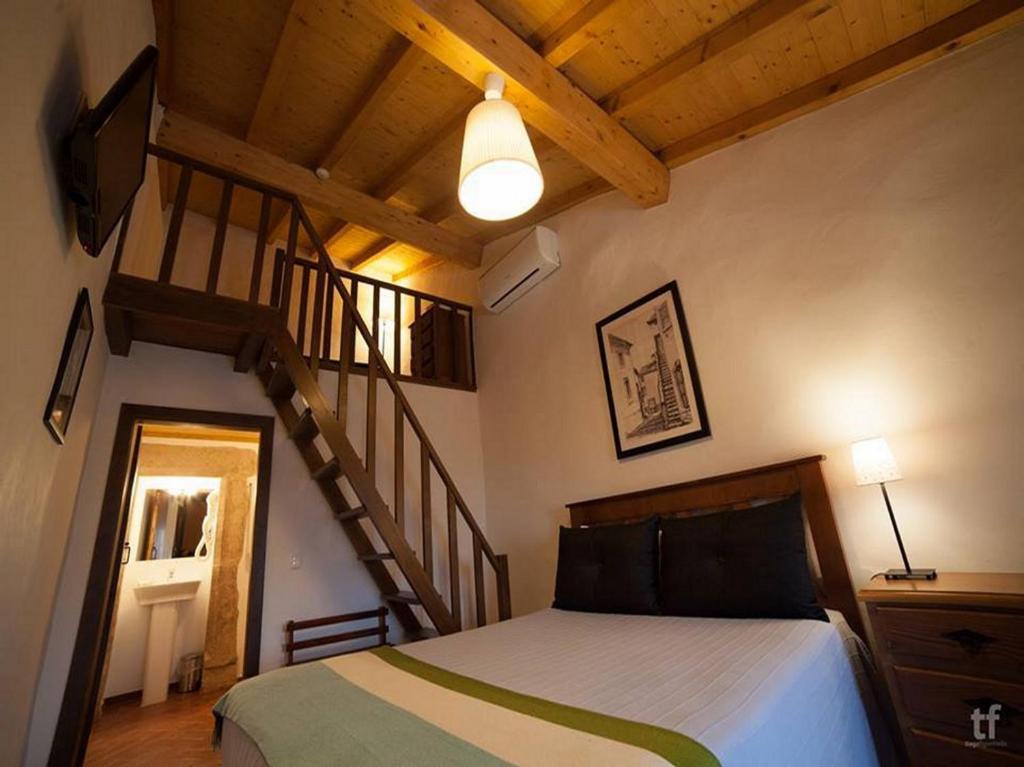 Postel nebo postele na pokoji v ubytování Estalagem de Marvão