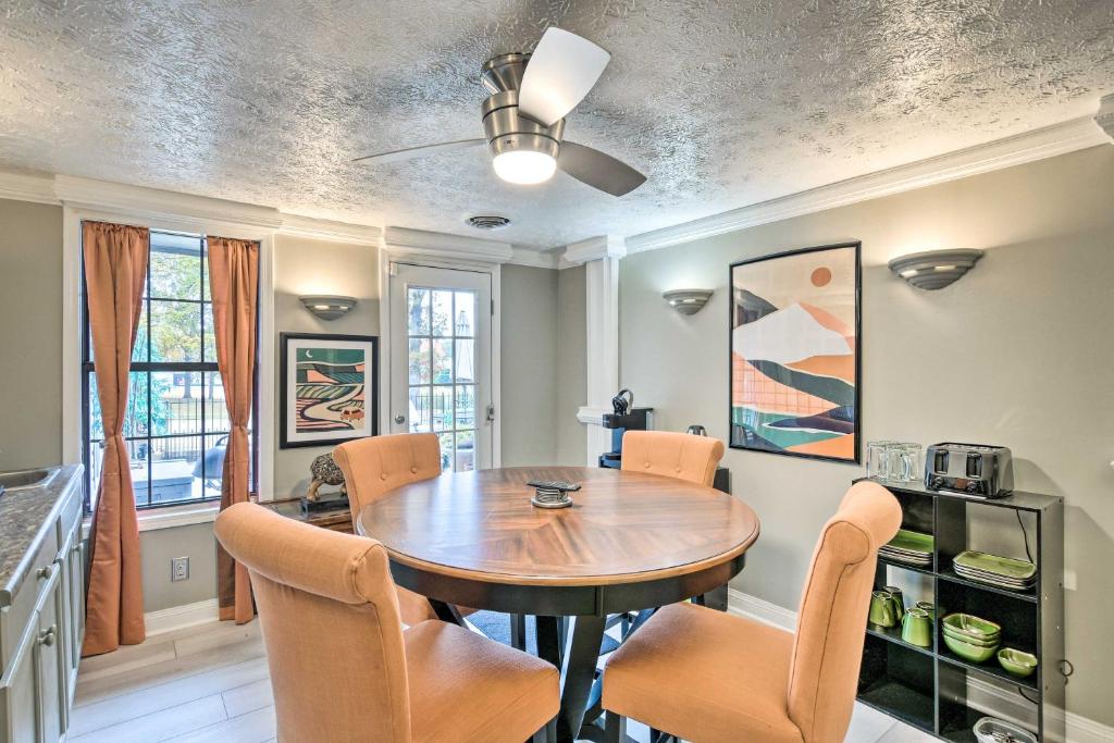 a dining room with a wooden table and chairs at Efficiency Apt Shared Conference Room, Patio in Greenville