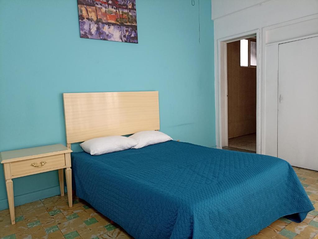 Postel nebo postele na pokoji v ubytování Hotel San Carlos