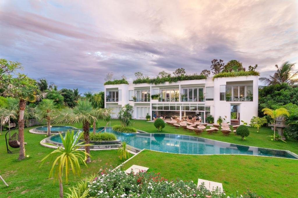 an exterior view of a villa with a swimming pool at Enjoy boutique in Siem Reap