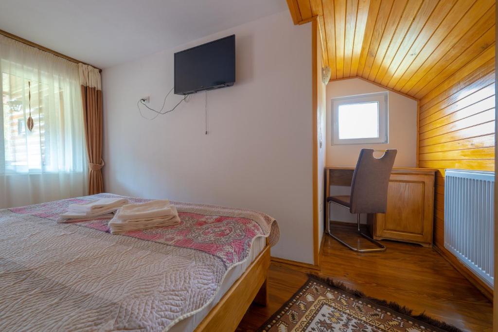 Postel nebo postele na pokoji v ubytování Cabana TYF - Dreptu