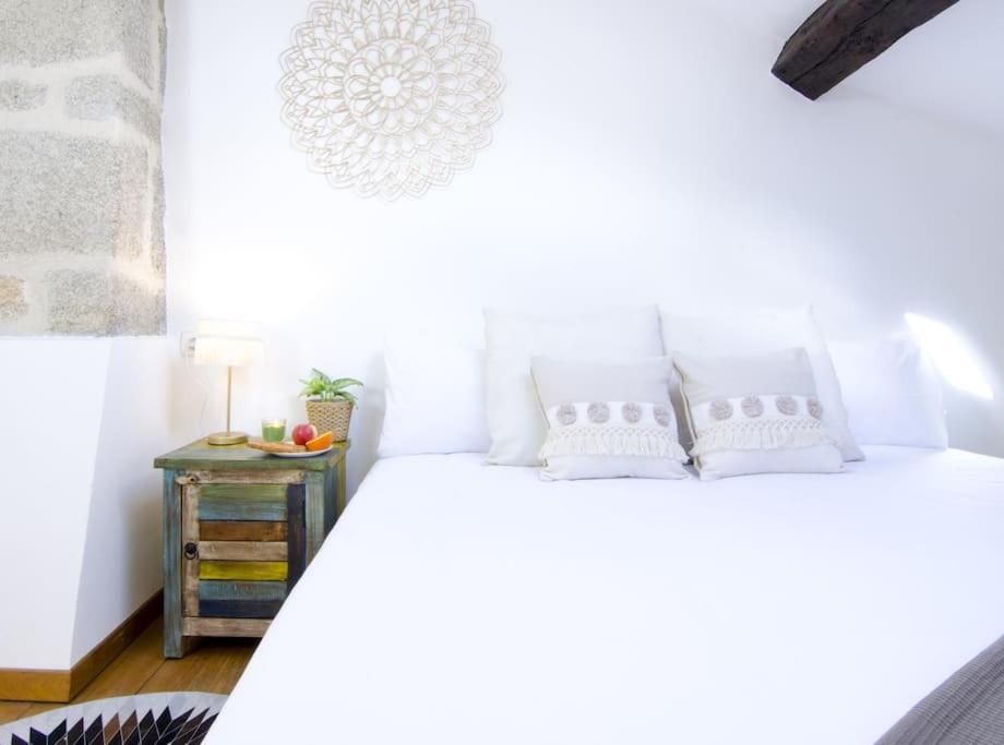 A bed or beds in a room at Vella Nova by Serendipia Turismo