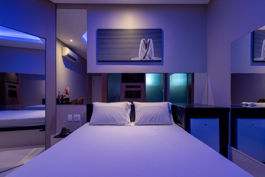 เตียงในห้องที่ Tucumã Motel