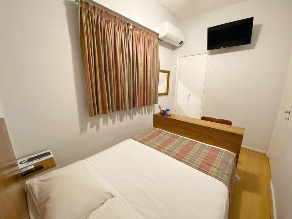 Postel nebo postele na pokoji v ubytování Hotel Rojas All Suite