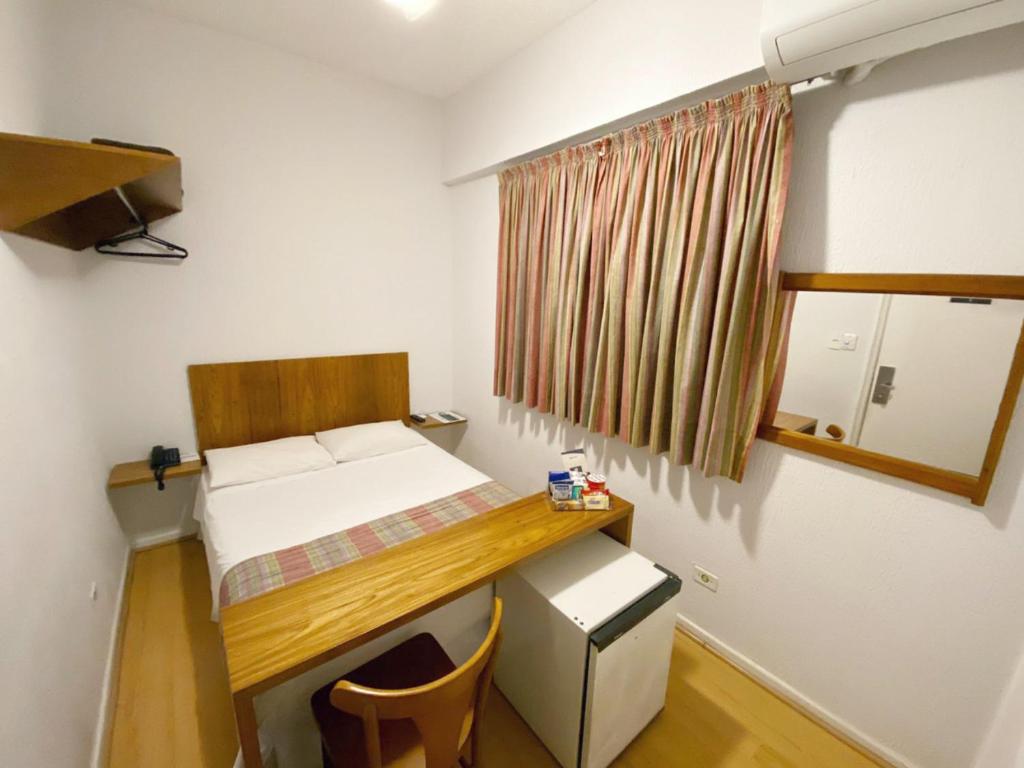 Postel nebo postele na pokoji v ubytování Hotel Rojas All Suite
